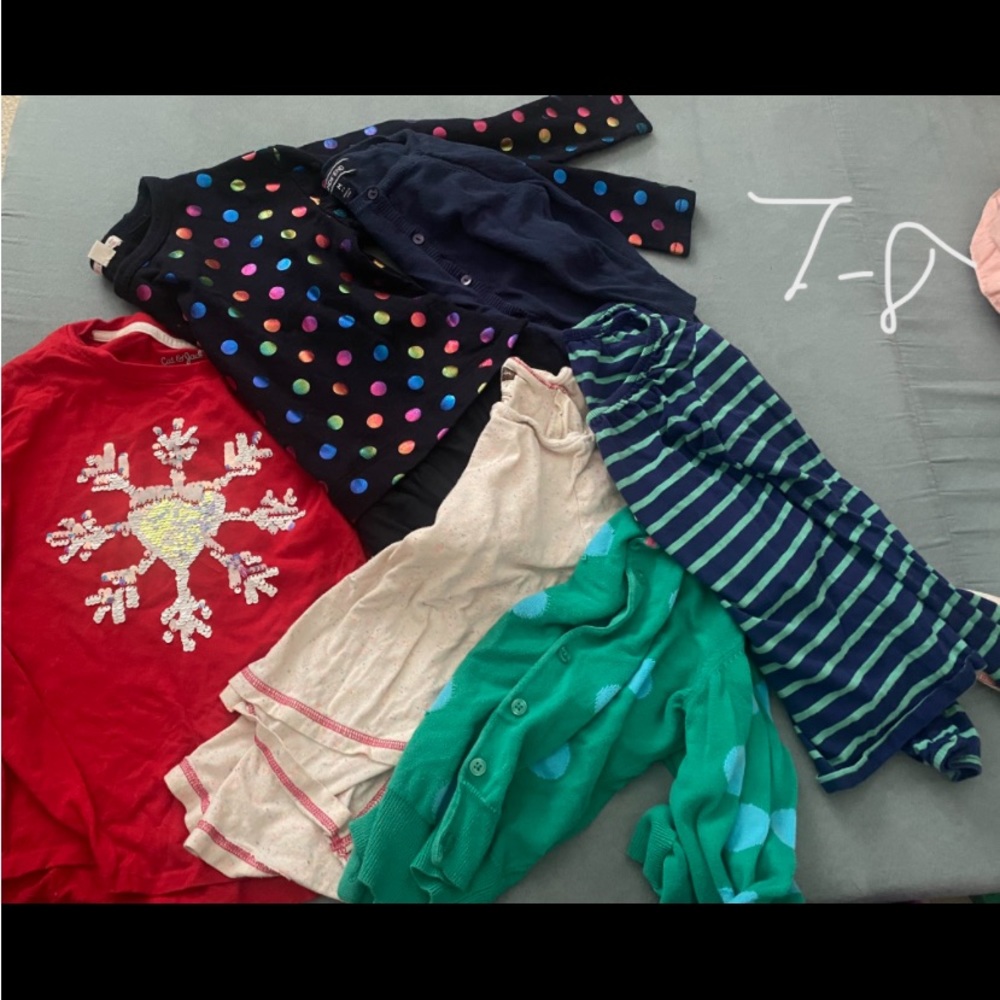 Lot of girls shirts and a sweater